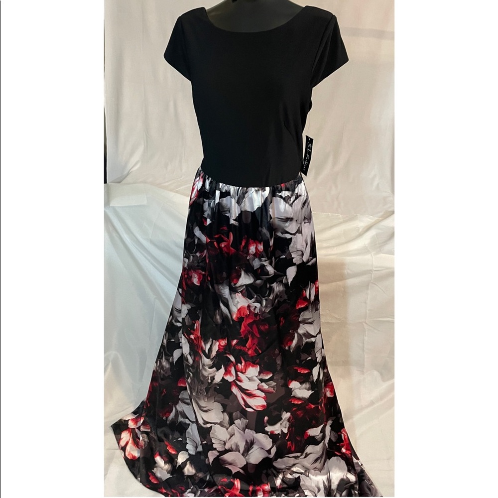 Short sleeve longs black gown with red flowers. Dress also has a slight tail.